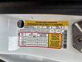 Tire and loading information label on a 2016 Ford Transit Connect detailing seating capacity and tire pressure for different tire sizes