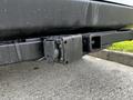 Close-up of a 2017 Mercedes-Benz Sprinter's rear hitch attachment with a connector visible