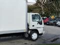 2007 GMC W5500 18 Foot Cube Van with a white exterior and large cargo area visible from the side