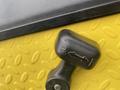 Close-up of a shift lever on a yellow Ez-go Industrial 800 showing directional indicators for reverse and forward