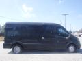 A black 2016 Ford Transit van with a boxy shape and a single passenger side door