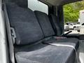 Interior seating of a 2018 Hino 195 showing three seats with fabric upholstery and a seatbelt on the right side