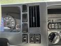Dashboard of a 2007 GMC W3500 featuring a speedometer, ventilation controls, and various switches