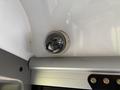 A ceiling-mounted security camera inside a 2020 Chevrolet Express with a circular design and lights inside the dome