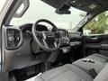 Interior view of a 2022 GMC Sierra 1500 with a steering wheel dashboard and key fob on the seat