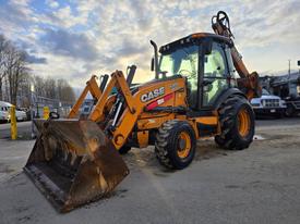 2015 Case 590SN backhoe loader with yellow and black coloring features a front bucket and rear excavator arm designed for construction and excavation tasks