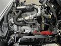 Engine of a 2019 Hino 195 with visible components including hoses and turbocharger in a compact layout
