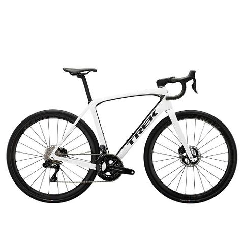 2025 Trek Domane SLR 9 Gen 4 Road Bike with a sleek white frame carbon fiber body disc brakes and high-performance components