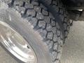 A close-up view of a tire from a 2017 Ford F-550 showcasing its detailed tread pattern and metallic rim
