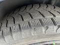 Close-up of a textured tire from a 2022 Dodge Charger showcasing deep treads designed for enhanced traction and stability