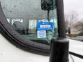 A 2016 International CE300 bus with a certificate of approval sticker on the windshield displaying the months January February and March