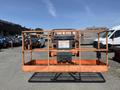 A 2008 JLG Boom Lift is shown with an orange platform and safety railings designed for lifting personnel to elevated heights