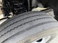 Close-up of a tire from a 2022 Ford F-550 showing tread patterns and sidewall detail
