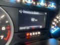 Close-up of a 2018 Ford F-150 dashboard displaying the distance to empty as 92 km and total mileage as 250487.2 km with gear shift indicators