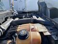 Close-up view of the engine compartment of a 2014 International 7400 featuring a coolant reservoir and various engine components