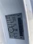 A 2019 Nissan NV200 vehicle identification label displaying specifications and manufacturing details