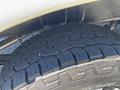 Close-up of a tire from a 2019 Mercedes-Benz Sprinter showcasing the tread pattern and rubber texture