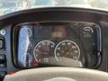 Dashboard of a 2015 Freightliner M2 106 showing gauges for RPM speed and fuel alongside warning lights and an odometer reading 201268 km