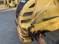 A yellow 2007 Komatsu WB156PS-5 machine with visible rust and wear on the front body and grill sections