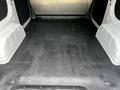 The interior cargo space of a 2020 Nissan NV200 showing a spacious, bare floor with no items inside