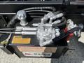 Close-up of hydraulic components including hoses and valves from a 2009 Ford LCF 550 truck's hydraulic system