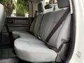 The rear seats of a 2013 RAM 3500 in gray fabric with seat belts