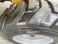 Close-up of a treaded tire from a 2024 AGT KRW 23 Mini loader showcasing its robust designs for improved traction and stability