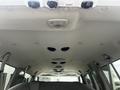 Interior view of a 2008 Ford Econoline showing the ceiling with multiple ventilation ducts and lighting fixtures