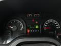 Dashboard of a 2009 Ford Econoline showing speedometer and various gauges including fuel level odometer and trip meter
