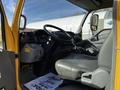 Interior of a 2017 Hino 155 showing the driver's seat steering wheel and dashboard with various controls and a floor mat