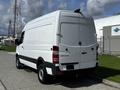 A white 2017 Mercedes-Benz Sprinter van viewed from the rear with a closed rear door and a high roof design