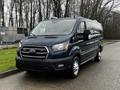 A blue 2020 Ford Transit van parked on a pavement with a sleek design and prominent front grille