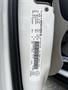 A 2011 Dodge Grand Caravan with a vehicle information sticker visible on the inner door frame