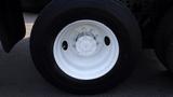 Close-up of a white wheel rim on a black Michelin tire designed for a 2003 International 5600i truck