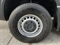 Close-up of a wheel from a 2017 Mercedes-Benz Sprinter featuring a silver rim and a black tire with the brand name Toyo and model Open Country displayed on the sidewall