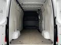 Interior of a 2021 Mercedes-Benz Sprinter van showcasing an empty cargo space with smooth walls and a flat floor