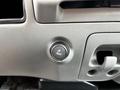 A close-up view of a button and panel inside a 2007 Ford F-550 vehicle's interior