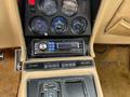 Dashboard of a 1970 Chevrolet Corvette featuring gauges for fuel, water temperature, oil pressure, and battery along with a modern audio system