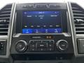 Dashboard display of a 2020 Ford F-350 featuring audio controls navigation and settings options
