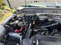 2012 Ford F-450 SD engine compartment with visible engine components battery wires and hoses