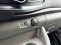 A close-up view of the dashboard area in a 2023 Ford Transit showing a USB port and a 12V power outlet