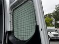 A 2019 Mercedes-Benz Sprinter van showing a metal grid security screen installed on the interior side of the rear door