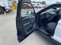 2021 Ford Explorer with an open driver's side door showcasing the interior and dashboard details
