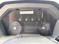Dashboard of a 2013 Ford F-550 featuring gauges for RPM speed and fuel level with a gear selector displaying P R N D 3 2 1