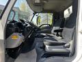 Interior of a 2020 Hino 195 featuring two fabric upholstered seats and a dashboard with various controls and displays