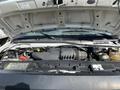 A 2008 Ford Econoline engine compartment showing the engine and various components under the hood