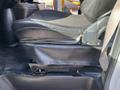 A black leather seat from a 2017 Chevrolet Express with a visible metal base and seat adjustment lever