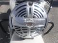 A silver Harley-Davidson WL engine cover featuring a distinctive logo with wings and a chevron design