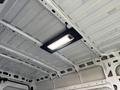 The ceiling interior of a 2021 RAM Promaster showing a strip light mounted in the center