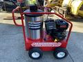 A red and silver 2024 Magnum 4000 Hot Water Pressure Washer with a large cylindrical water tank and mounted engine on a wheeled frame